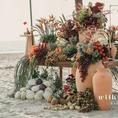 An abundant tropical fruit and floral installation for a sundowner event in Goa. This design blends the natural beauty of the beach with an overflowing display of local produce, creating a sensory feast for guests right on the sand.