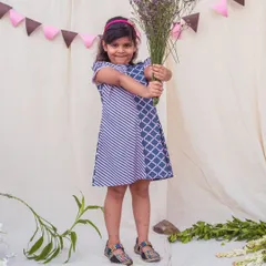 This A-line dress features a fun mix of geometric and striped patterns. It's a comfortable, easy-to-wear piece with flutter sleeves that's perfect for a stylish and active girl.