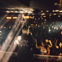 A shot from behind Mika Singh, showing his perspective of the cheering crowd. This unique angle provides a dynamic view of the concert experience.