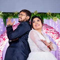 A fun and playful pose from the couple at their Catholic wedding reception, showing their personalities and the joy of the celebration.