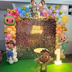 A closer look at the Cocomelon themed balloon arch and character cutouts, designed to create a perfect photo opportunity.
