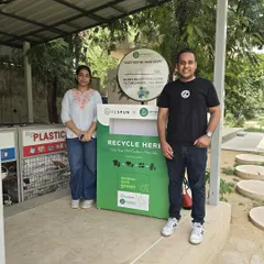 Two members of our community stand proudly by the newly installed Respun collection bin. Each item of clothing donated saves about 6 kg of CO2 and 2700 litres of water.