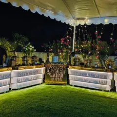 The rooftop garden at Ashirwad Banquets transforms into a magical setting at night. This illuminated buffet setup under the stars is perfect for evening receptions, sangeets, or corporate dinners.