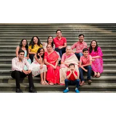 A vibrant, multi-generational family portrait session on a set of outdoor steps. We love the challenge of getting everyone from grandparents to the youngest kids laughing and looking great in one frame.