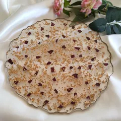 For a more abstract way to preserve your flowers, I can create a decorative tray like this one. This 10-inch piece features scattered red rose petals and gold flakes, perfect for an engagement ring platter or a beautiful centerpiece.