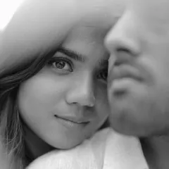 An intense, artistic, and soulful black and white close-up. This kind of portraiture aims to capture the deep, unspoken bond between two people.