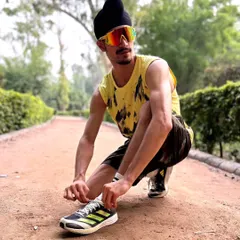 Lacing up my running shoes. Whether it's on the track or in the park, regular running is essential for maintaining peak physical condition.