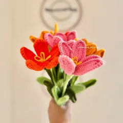 Holding a bouquet of my handmade open tulips. This angle shows the green stems and how the flowers look when gathered together as a complete arrangement.