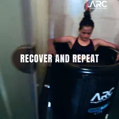 Recover and repeat. An athlete uses a portable ice bath after an intense training session. This cold water immersion helps reduce muscle soreness and inflammation, which is a critical part of the training cycle.