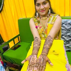A beautiful shot of the bride displaying her completed mehndi. We love capturing these moments of joy after our work is done.