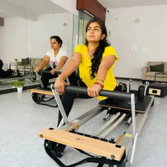 A duet reformer session in action. Working out with a partner is a great way to stay motivated and ensure proper form.