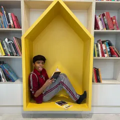 Another quick-fix solution for a library space. This house-shaped yellow reading nook provides a cozy and imaginative corner for children to get lost in a book.
