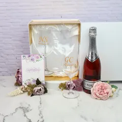 Cheers to special moments with my personalized wine glasses. This set, perfect for couples, can be customized with initials and comes beautifully packaged with a bottle of sparkling wine.