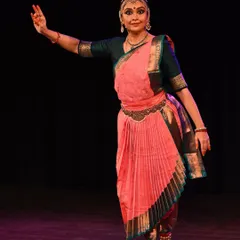 A classic Bharatanatyam stance, showcasing the intricate costume and precise hand gestures. Each element is rich with meaning and tradition.