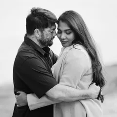An intimate black and white portrait capturing a quiet, tender moment between the couple. This style of pre-wedding photography focuses purely on emotion.