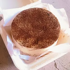 Inside the bento box is my Coffee Caramel cake. It's a mini cake with layers of coffee-soaked sponge and caramel cream, dusted with cocoa powder.