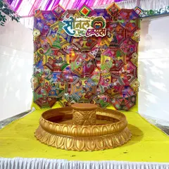 Personalization is key. For this Haldi, we created a custom sign in Marathi that reads 'Sonal cha Haldi Sohala' and placed it on a colorful backdrop made of decorative umbrellas, making the bride feel extra special.