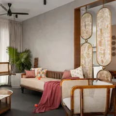 The living space of the 'Ittige' residence showcases our approach to modern Indian interiors. We integrated traditional elements like the wooden swing and cane furniture with a clean, contemporary layout, creating a space that feels both culturally rooted and refreshingly modern. The open plan allows for natural light to fill the room, connecting it to the outdoors.