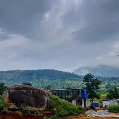 The site of the Soma house, with a large natural boulder in the foreground that we chose to preserve. The design process always begins with respecting the existing land, its features, and its moods.