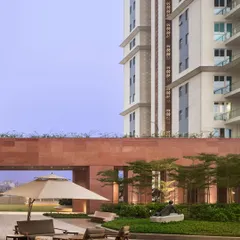 The Elevate Clubhouse in Gurugram is a 32,000 sq. ft. sanctuary designed to help residents reconnect. This view showcases how the architecture integrates with the landscape, creating a seamless transition from the built environment to the natural one.