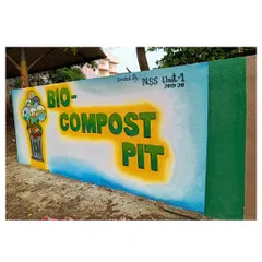A side-angle view of the Bio-Compost Pit mural in Karwar. This perspective shows how the artwork transforms a simple functional wall into a point of interest and education for the college community.