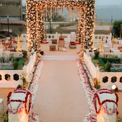 This is the kind of breathtaking entrance I love to create. For this Khandala wedding, I designed a grand floral archway and aisle, lined with custom elephant statues made of flowers, to give the couple a truly royal welcome to their ceremony.