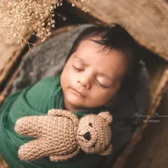 There is nothing more peaceful than a sleeping newborn. I am certified in safe baby posing, ensuring your little one is always comfortable and secure as we create these divine portraits with soft wraps and gentle props.