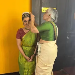 A precious moment with a senior guru before a performance. The blessings and guidance of our elders are an invaluable part of an artist's life, connecting us to the deep roots of our tradition.