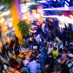 This is the 'Party Ninja' effect. An overhead shot capturing the whirlwind of energy on the dance floor. My job is to get everyone lost in the music.