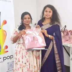 A happy student from my first batch receiving her welcome kit. I provide all the practice materials you need to get started right away.