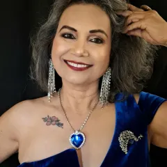 I believe glamour has no age. For this look on mature skin, I used techniques to create a radiant, lifted effect that doesn't settle into fine lines. The sapphire blue and silver tones create a bold, elegant statement perfect for any special occasion.