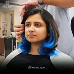 Don't be afraid to play with color. I added these electric blue peekaboo highlights to give this client's look a bold, edgy surprise. This technique is perfect for expressing your personality while maintaining a professional base color.