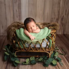 To the most gorgeous little boy. I love using earthy tones like green, which complement a rustic wooden backdrop and bring a natural feel to the portrait.