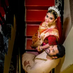 I love finding unique perspectives. This top-down shot of a couple on a staircase adds a creative, storybook feel to their wedding portraits, turning a simple moment into a memorable piece of art.