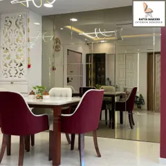 This view highlights the seamless flow between the dining area and the rest of the living space, unified by a consistent color palette and luxurious finishes.