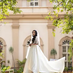 A bride in her serene moment before walking down the aisle. I focus on capturing the quiet elegance and anticipation that makes Christian weddings so beautiful.