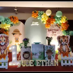 For Jude Ethan's 'Wild One' party, I created a friendly and inviting jungle scene. This setup includes adorable, life-sized cutouts of a lion, tiger, elephant, and zebra, a large light-up number '1', and marquee letters for the name, all set against a custom backdrop and framed by organic balloon arrangements.