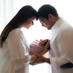 There is so much love in the quiet moments right after a baby arrives. I love using soft, natural light to capture the beautiful connection between new parents, creating a timeless portrait of your new family.