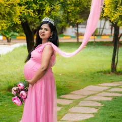 This is your fairytale moment. For this outdoor maternity session, we used a beautiful pink gown and flowing fabric to create a dreamy, ethereal portrait that celebrates the magic of motherhood.