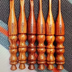 I offer a range of classic, fully wooden crochet hooks. They are polished for a smooth glide and carved to fit comfortably in your hand, with the size clearly marked on each one.