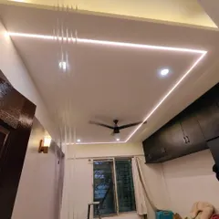 A freshly painted bedroom ceiling featuring modern cove lighting. We ensure that ceilings are painted perfectly smooth to enhance the effect of any lighting installations.