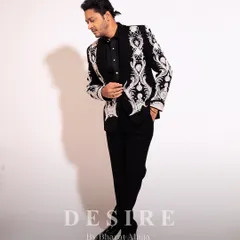 A profile of power. This full-length shot showcases the silhouette of my custom embroidered jacket. The design is intentionally bold on the lapels and cuffs to create a strong, confident frame.