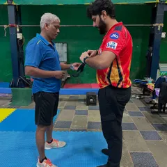 One of our coaches getting fitted with a Firstbeat monitoring device. Our coaching staff also uses this technology to optimize their own training and better guide our students.