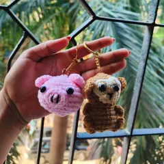 My crochet pig and monkey keychains together. I love how their little personalities come out in the details, from the pig's snout to the monkey's big eyes.