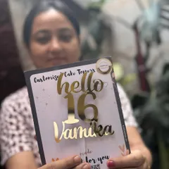 Turning sixteen is a big deal, and this "Hello 16 Vamika" topper is the perfect way to mark the occasion. The combination of script and block fonts gives it a trendy, youthful vibe.