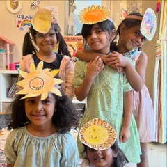 A group of smiling suns. The kids are so proud to wear the sun headbands they created during our "All About the Sun" session.