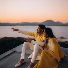 Pia and Zubin watch the sunset over the serene waters at Sula Vineyards. I love using grand landscapes to frame a couple's story, making them the heroes of their own cinematic romance.