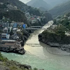 The stunning Devprayag Sangam, where the Alaknanda and Bhagirathi rivers merge to form the holy Ganga. This is a key stop on our Char Dham Yatra.