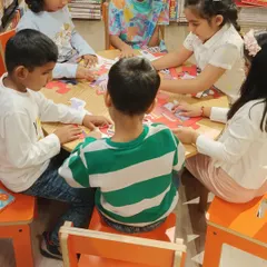 Puzzles are a great way to develop problem-solving skills. Here, a group of children works together to complete a puzzle during one of our activity sessions, learning teamwork along the way.