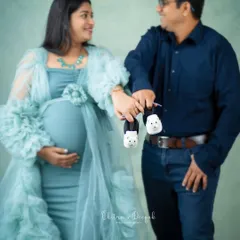 It's all in the details. This sweet shot of the couple holding tiny baby shoes is a perfect way to announce the upcoming arrival.